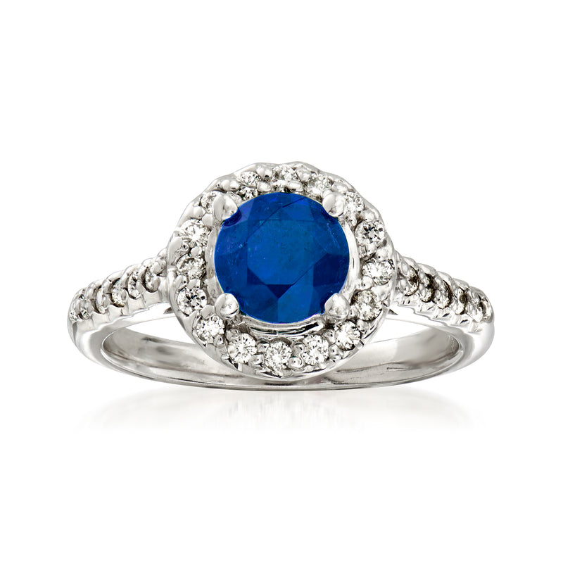 14kt white gold halo ring with oval blue sapphire center and diamond accents