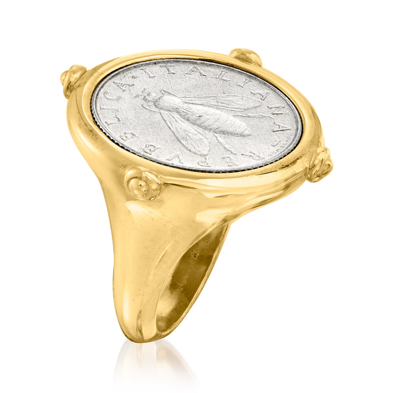 Gold-tone coin ring, side view of oval silver coin face in round bezel with rope edges