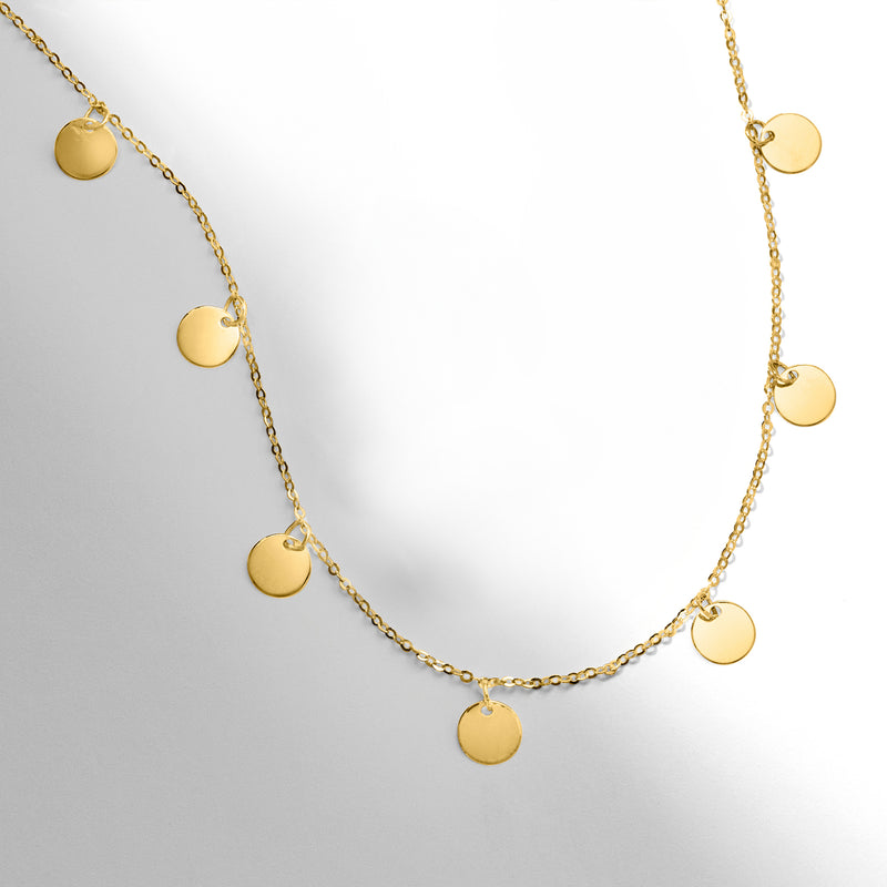 14kt yellow gold multi-circle necklace with round disc charms, angled view