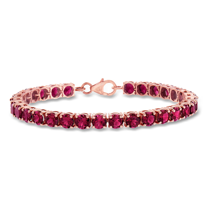 Rose gold rhodolite garnet tennis bracelet with oval pink-red gemstones and clasp