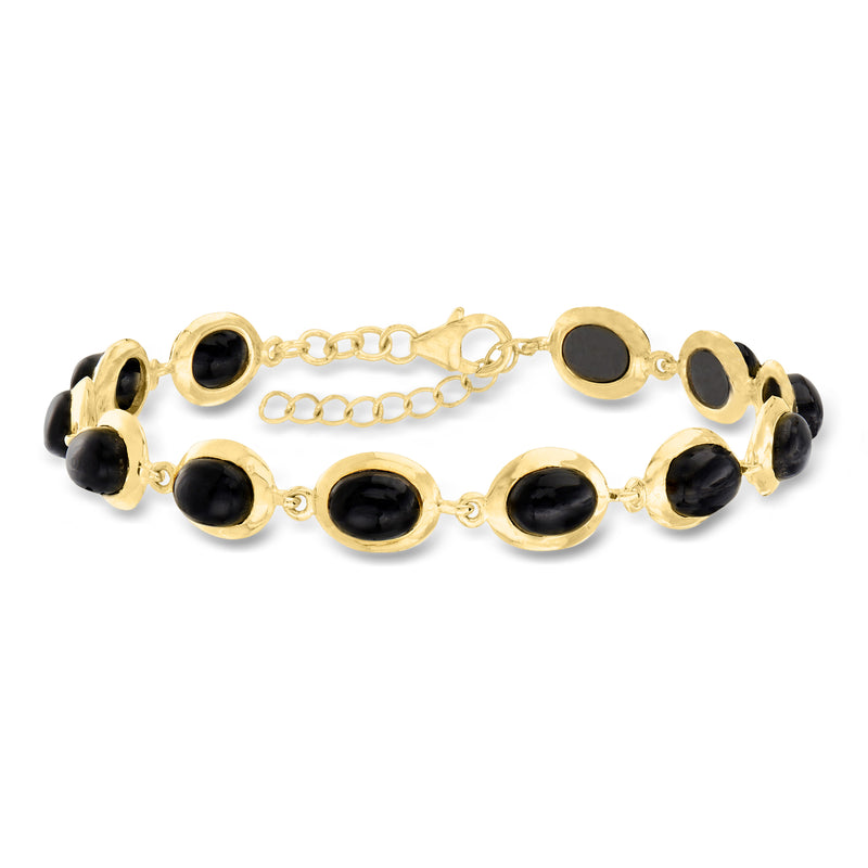 Gold-tone bracelet with black oval onyx cabochons and oval link chain, clasp at center