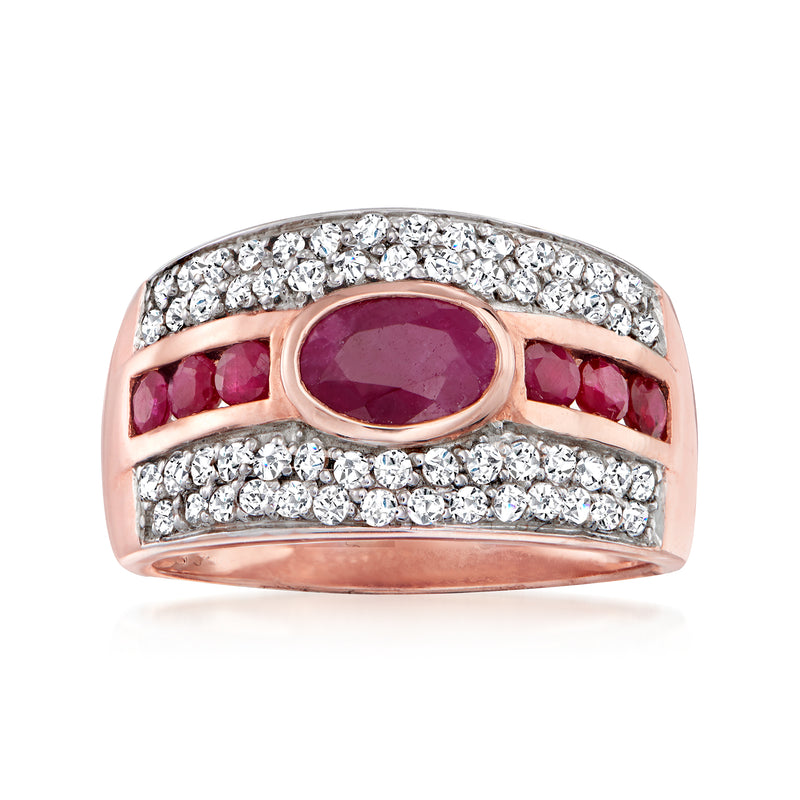 Rose gold ring with oval ruby center and white zircon accents plus red side stones