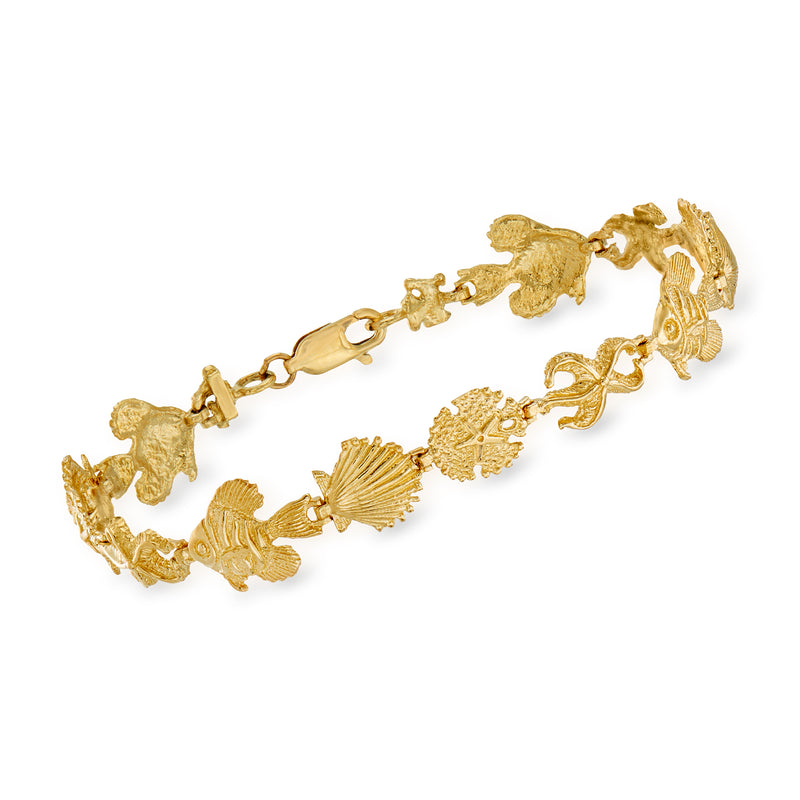 14kt yellow gold sea life bracelet with detailed fish, shell, and chain links