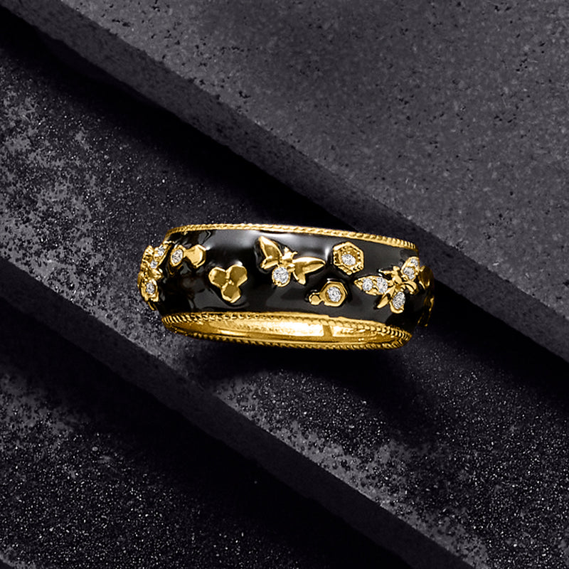 Black enamel bumblebee ring with gold-tone band and sparkling stone details
