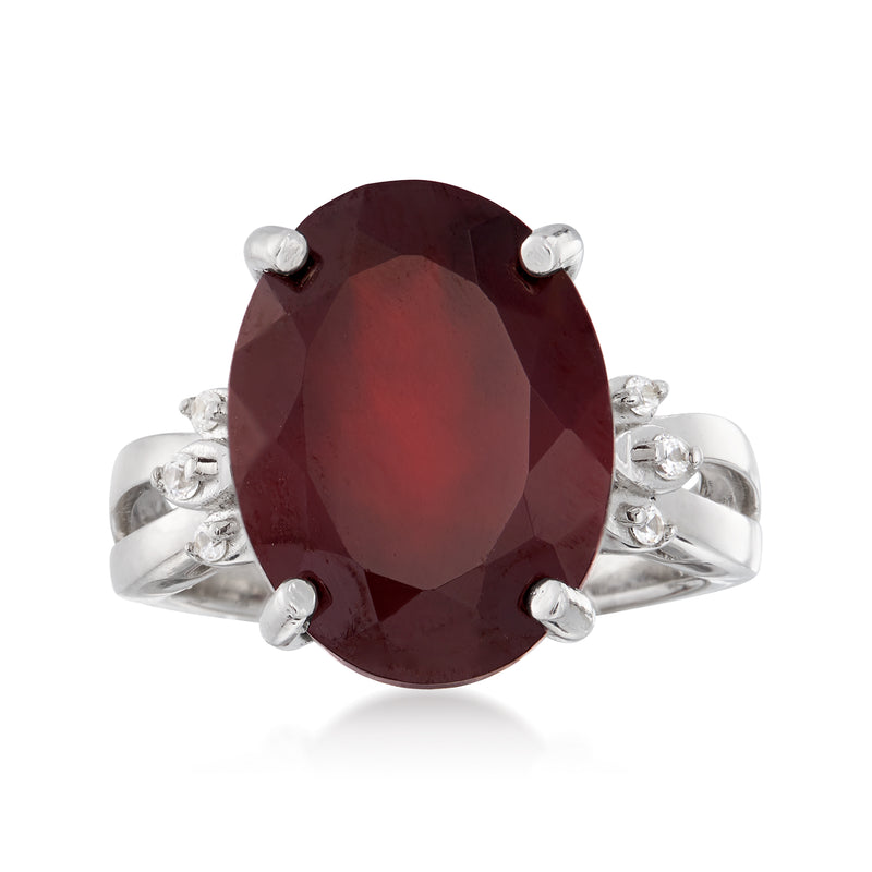 Sterling silver ring with oval maroon garnet center and small white topaz accents