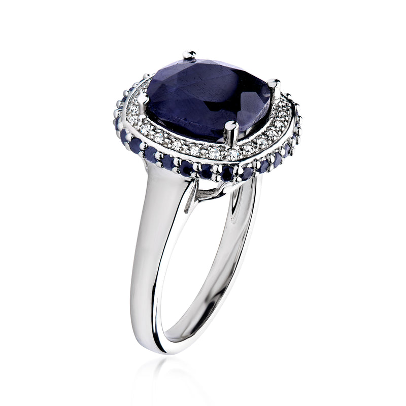 Sterling silver ring with oval dark-blue sapphire, textured halo and split band