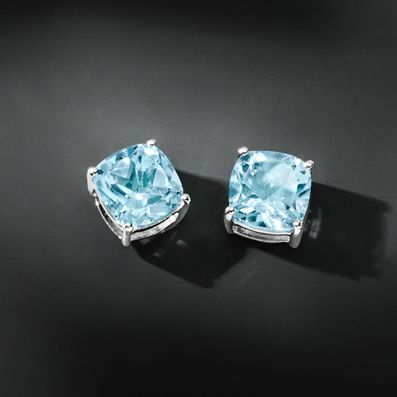 Sky blue cushion-cut topaz stud earrings in sterling silver, prong-set square shape