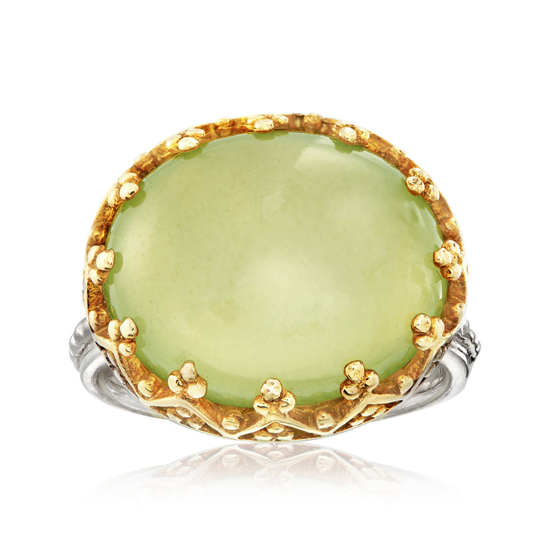 Two-tone sterling silver prehnite ring with large round green gemstone bezel setting.