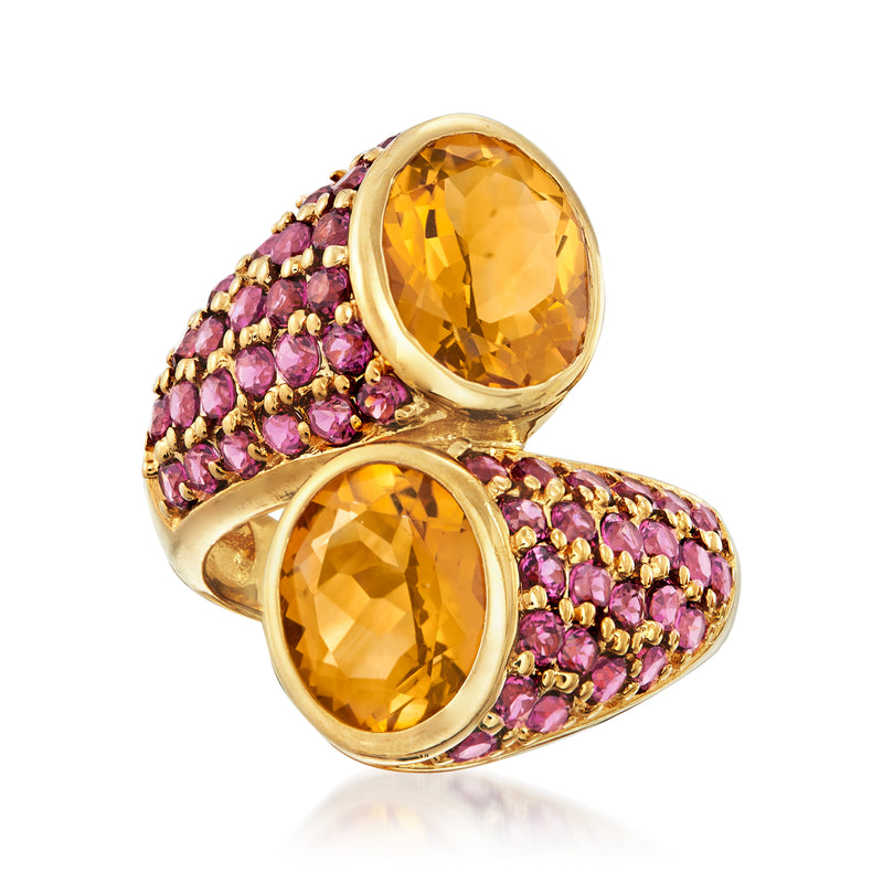 Gold bypass ring with oval citrine stones and pink rhodolite garnets
