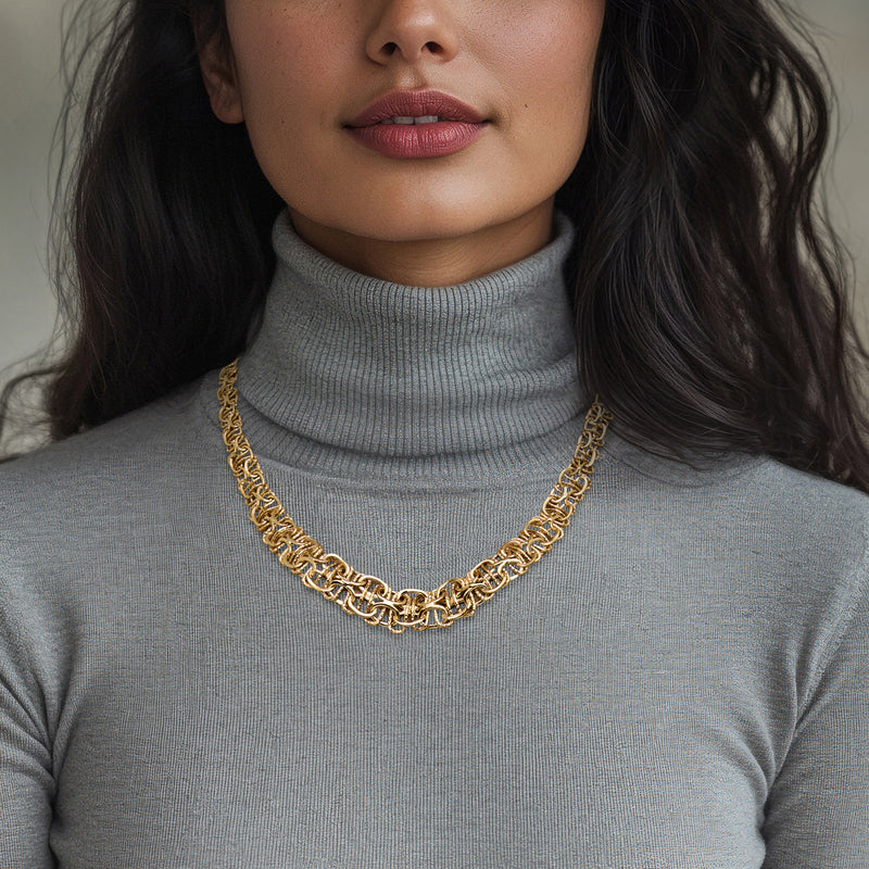 14kt yellow gold Byzantine chain necklace worn at collar, graduated link pattern