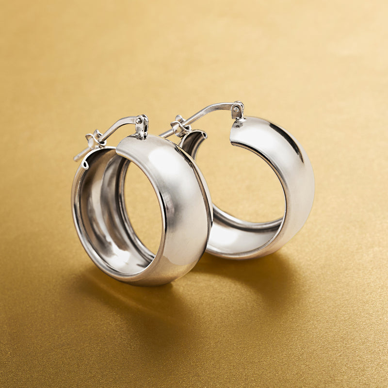Polished sterling silver hoop earrings, side view of two circular hoops