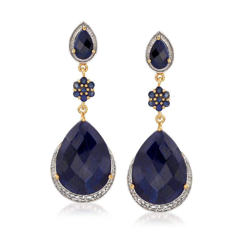 Gold-tone sapphire drop earrings with oval blue stones, halo detailing, and teardrop fringe