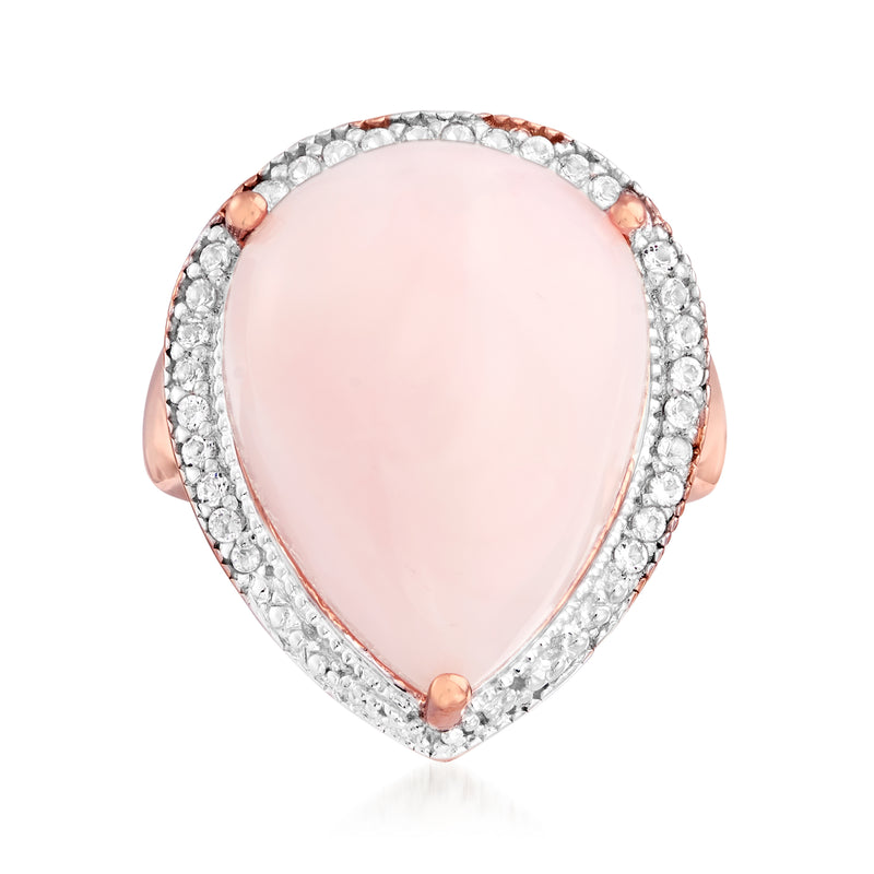 Pink teardrop opal ring with white topaz halo, rose-gold prongs on silver band
