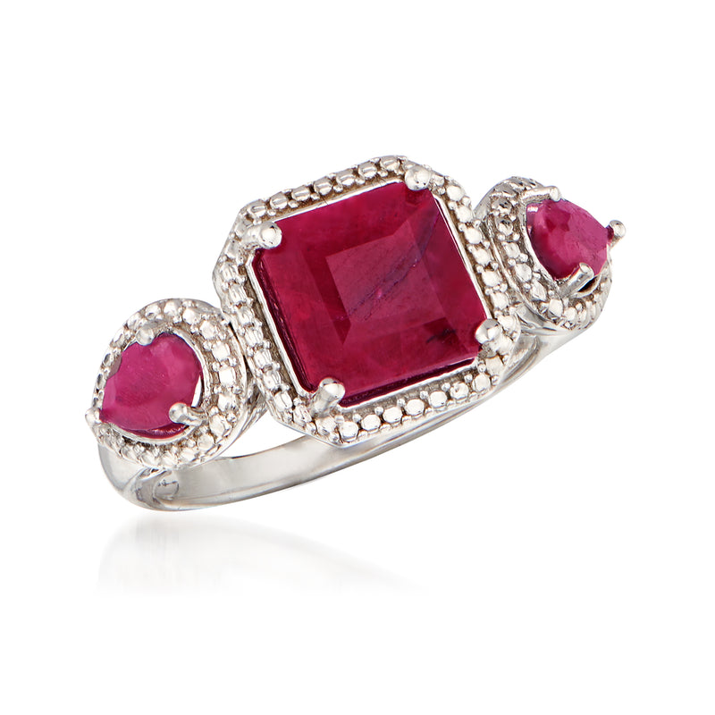 Sterling silver ruby ring with large cushion-cut red center and small side rubies