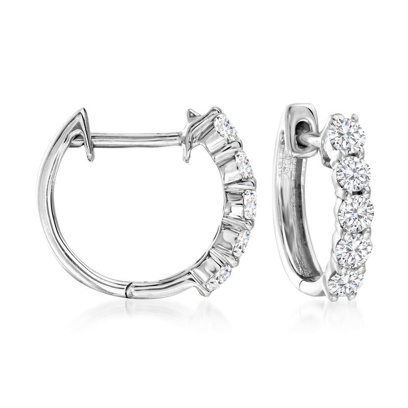 14kt white gold huggie hoop earrings with round diamonds along the front