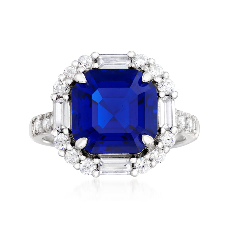 Sterling silver ring with large square blue gemstone and halo of round clear stones