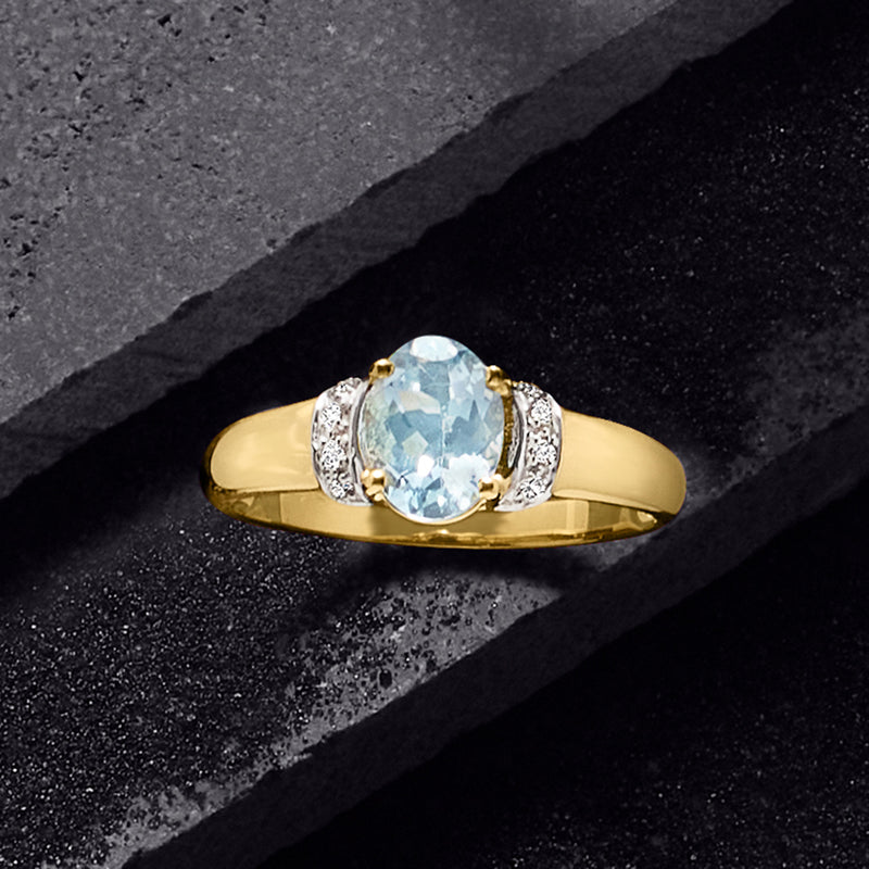 14kt yellow gold aquamarine ring with oval aquamarine and diamond side accents