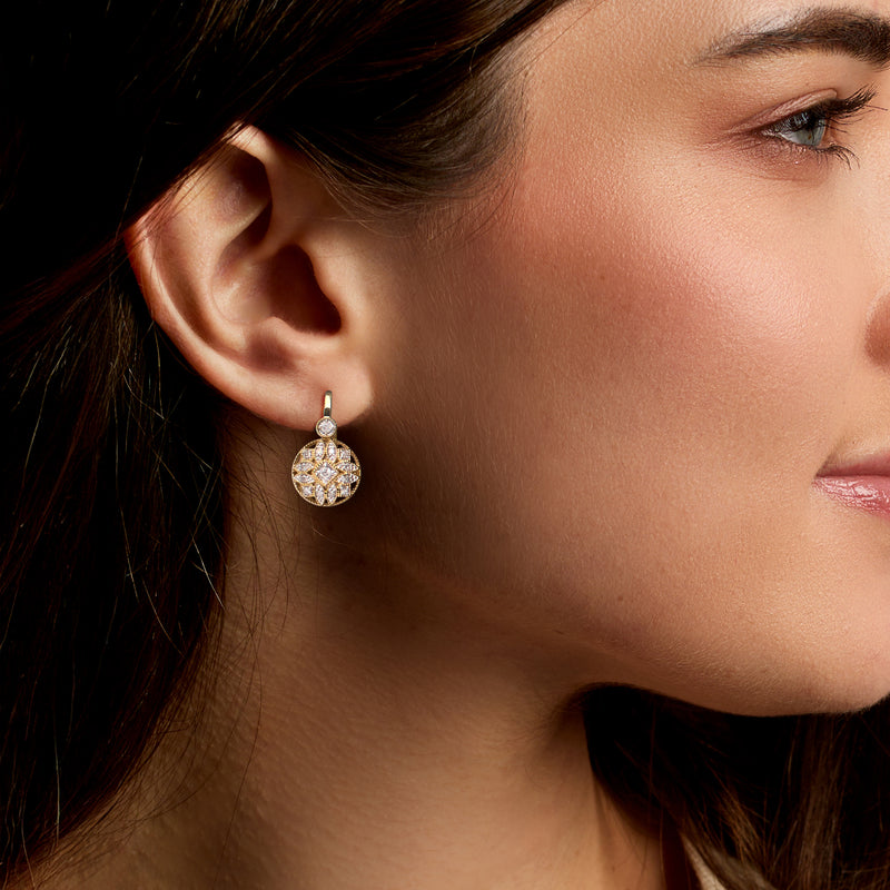 Diamond drop earrings in gold over sterling, round halo shown on ear