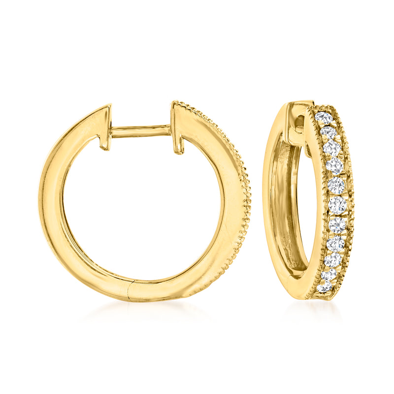 Gold hoop earrings with milgrain edge and row of diamond accents on the outer side