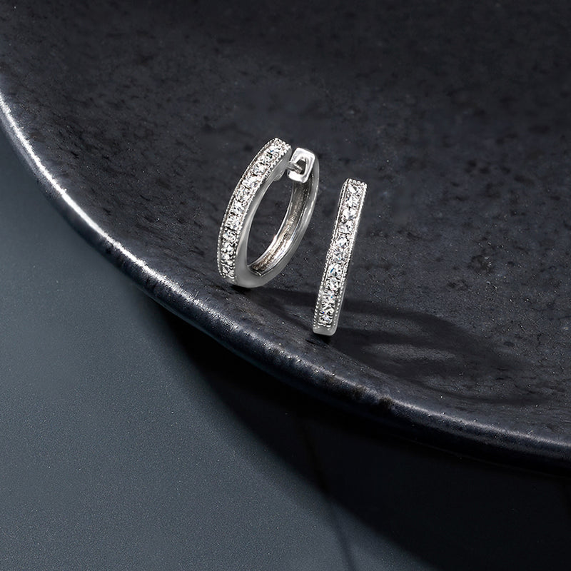 Diamond milgrain hoop earrings in sterling silver, shown as a pair