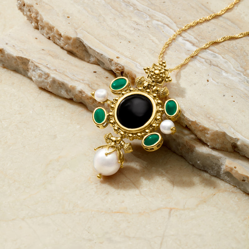 Gold-tone pendant necklace: black center, green enamel ovals, pearl beads and drop