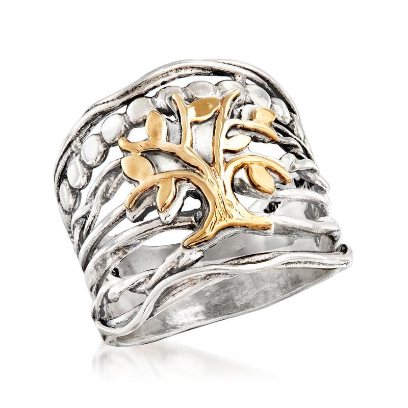 Sterling silver ring featuring a 14kt yellow gold Tree of Life centerpiece and curved band