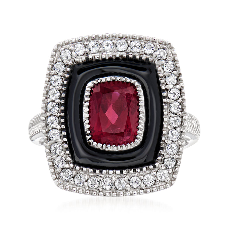 Sterling silver ring with black enamel frame, red rhodolite center, and white gemstone halo
