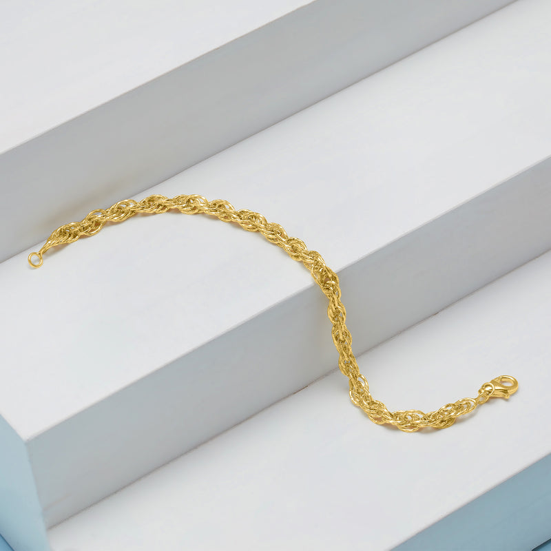 Gold rope-chain bracelet with lobster clasp, angled view