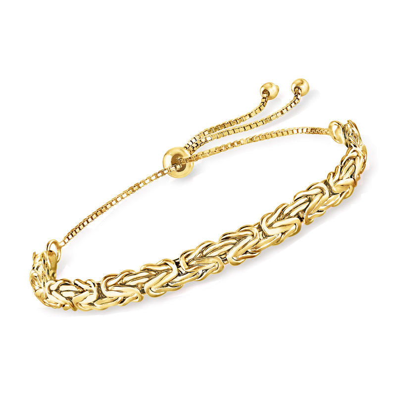 Gold-tone bolo bracelet with braided chain links and round end caps clasp