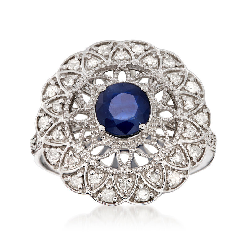 Sterling silver ring with round blue sapphire center and diamond halo filigree