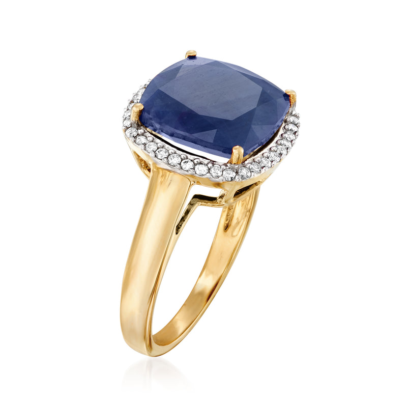 14kt yellow gold ring featuring a blue sapphire with diamond halo and gold prongs