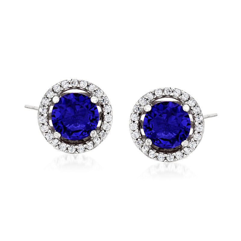Sterling silver blue halo stud earrings with CZ accents, round center stones