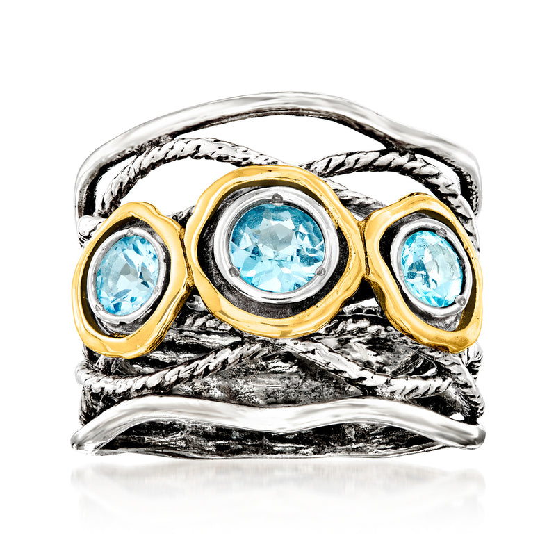 Sterling silver open-space ring with three Swiss blue topaz stones and yellow gold bezels