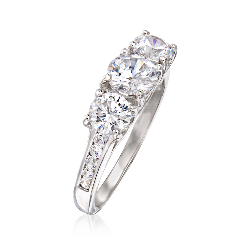 Sterling silver three-stone CZ ring with cushion prongs and sparkling round center stone
