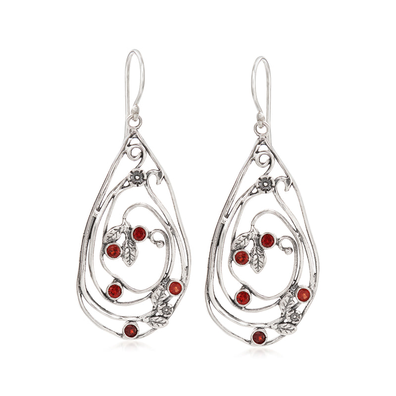 Sterling silver teardrop drop earrings with red garnet accents and open-space design