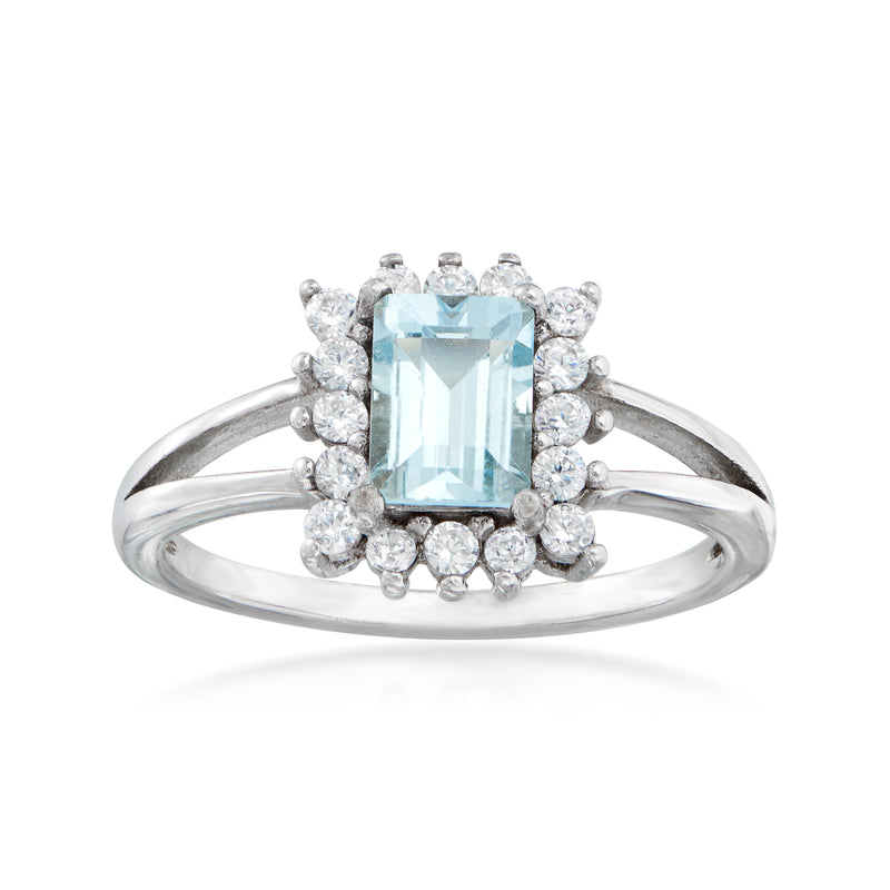 Sterling silver ring with aquamarine emerald-cut center and round white zircons halo