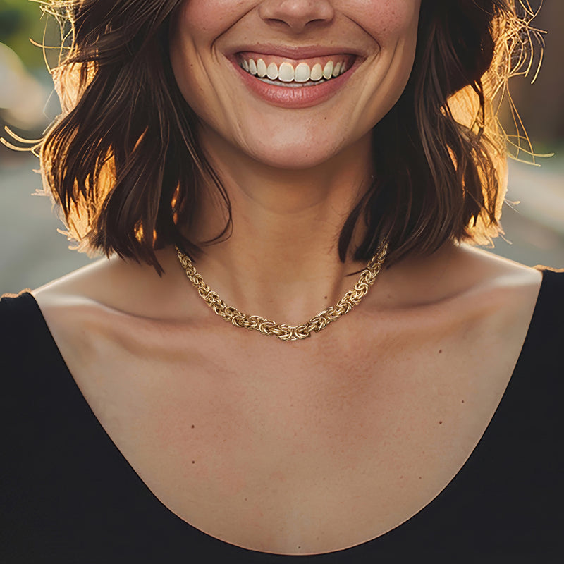 Graduated Byzantine link necklace in 18kt yellow gold, worn at collar
