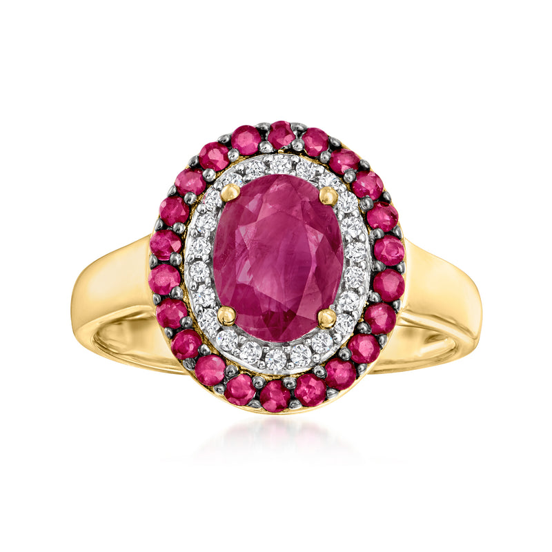 14kt yellow gold oval ruby center ring with diamond halo and pink ruby border