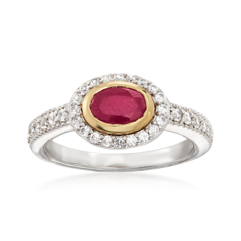 Sterling silver ring with oval red gemstone center, white zircon halo, gold bezel