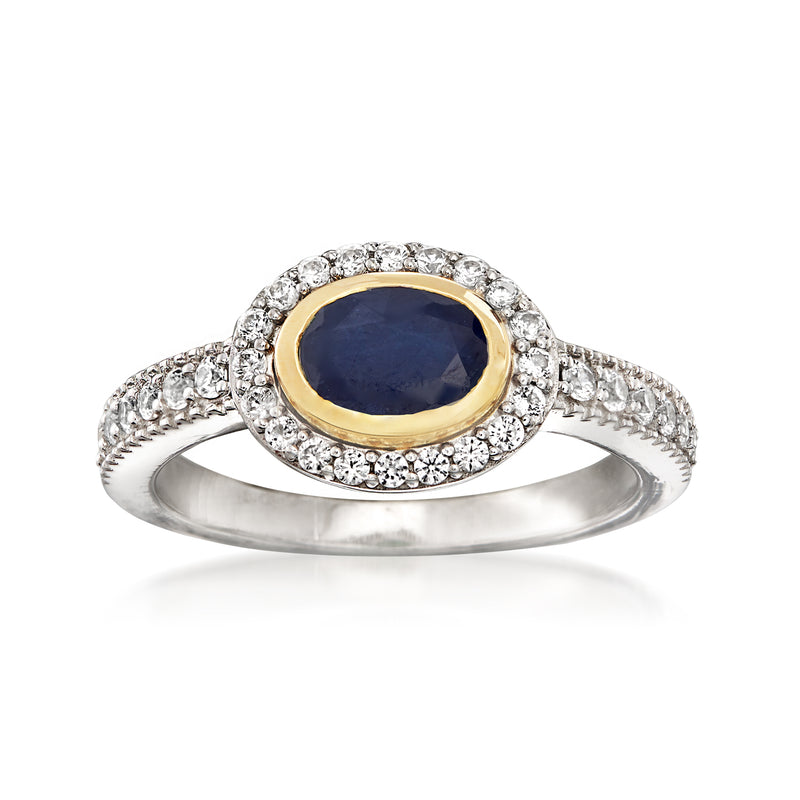 Oval sapphire ring with white zircon halo; sterling silver and yellow gold bezel