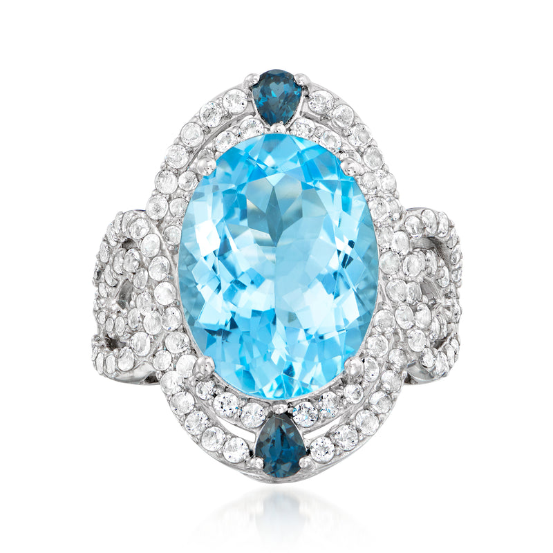 Sterling silver ring with oval blue topaz center and small blue side stones
