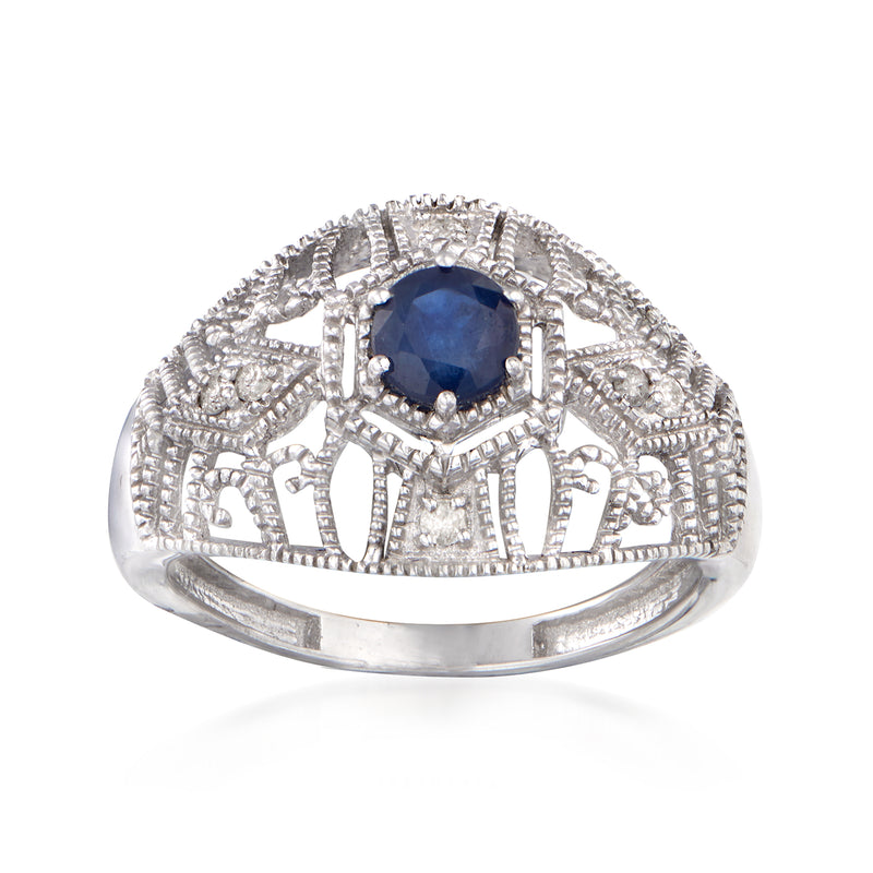 Sterling silver ring with oval dark blue sapphire and diamond-look side details