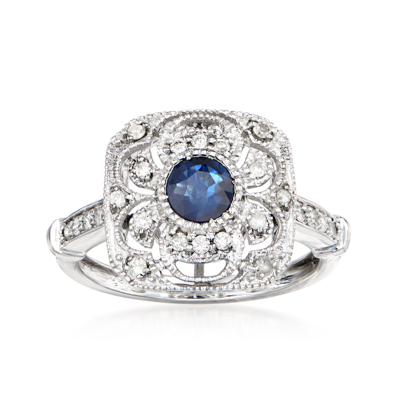 14kt white gold openwork ring with round blue sapphire center and diamond halo