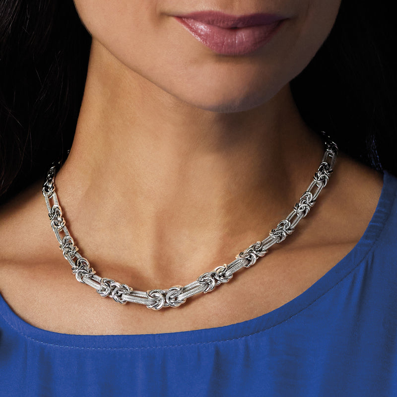 Sterling silver Byzantine double-link chain necklace on neckline, flat link pattern
