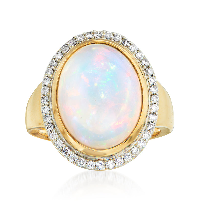 Oval opal diamond halo ring in 14k yellow gold with tapered band