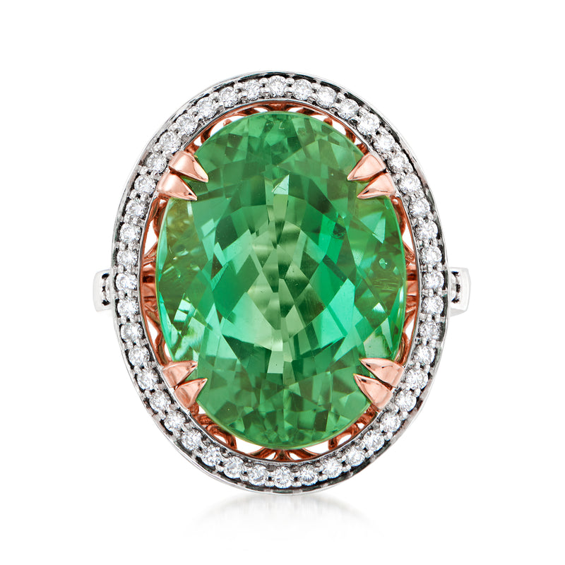 Oval green tourmaline ring with rose-gold prongs and diamond halo