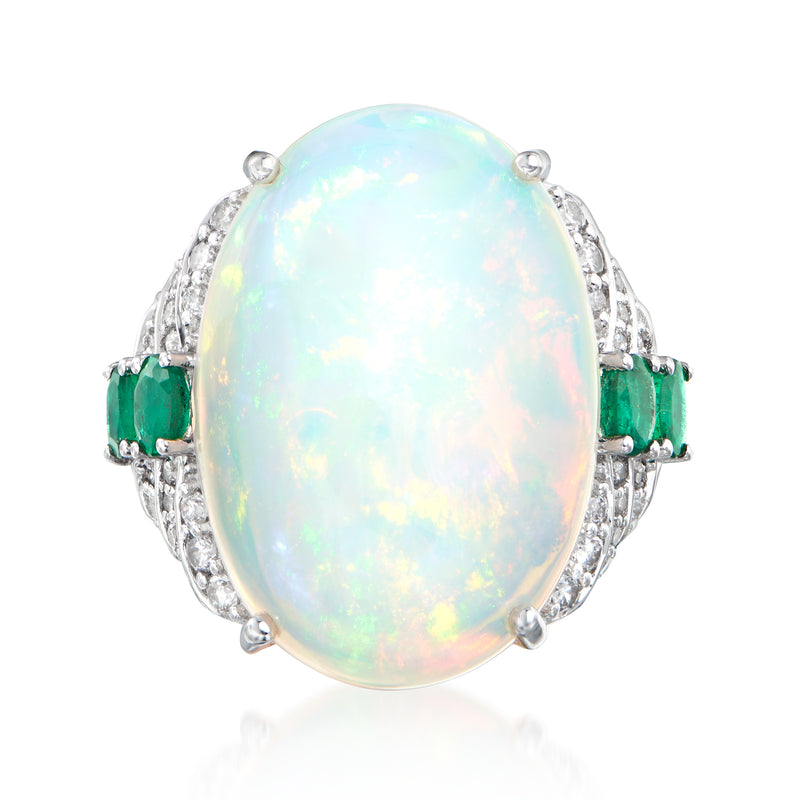 Oval opal and diamond ring in white gold with green emerald stones