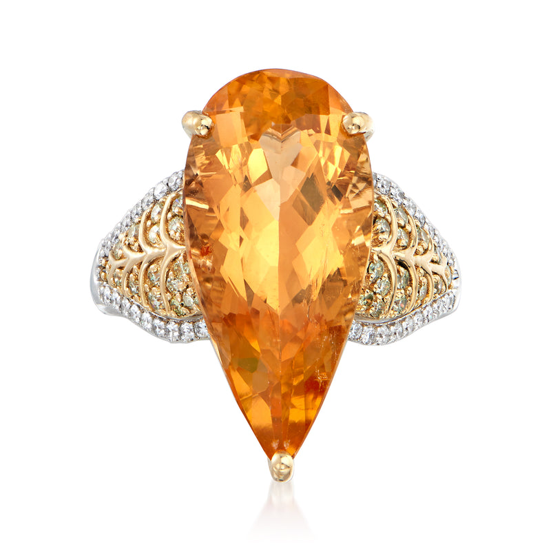 Two-tone gold ring with large pear-shaped orange-gold topaz and diamond halo shoulders