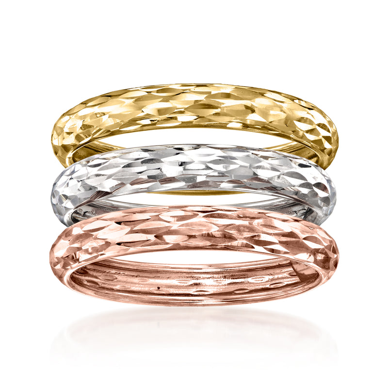 Three tri-colored 14k gold rings with diamond-cut textured bands, polished finish