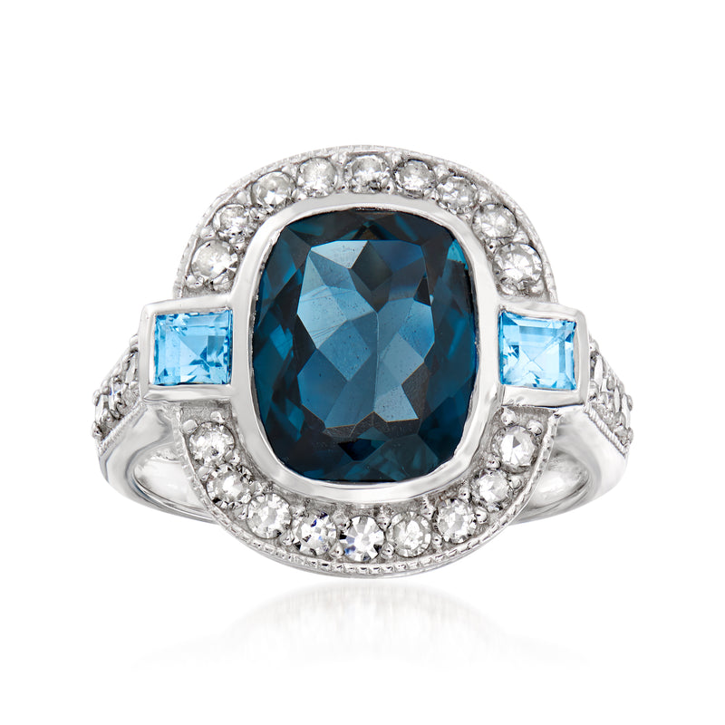 Sterling silver ring with oval blue topaz and diamond halo, plus square blue stones